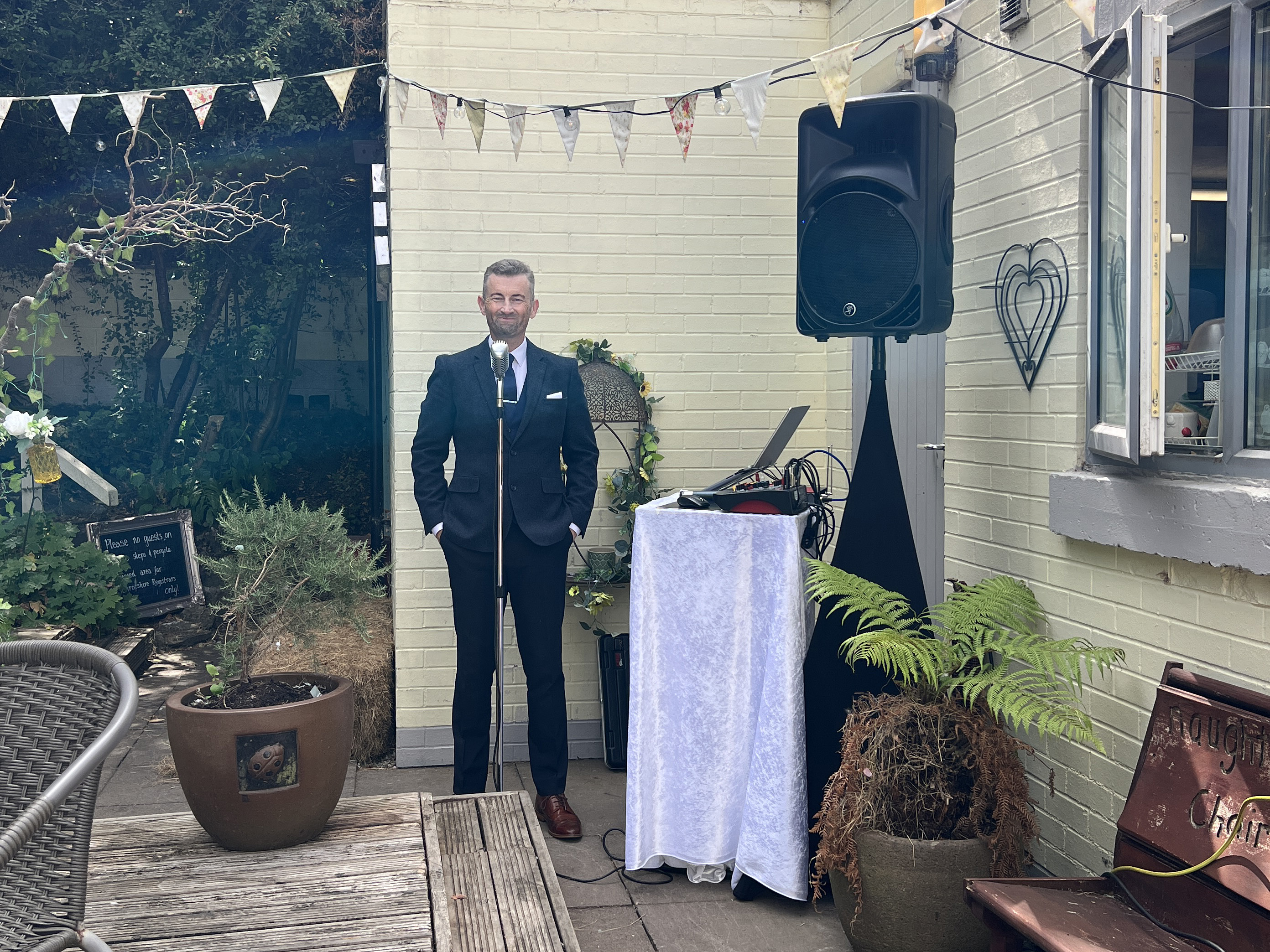 singing in the venue corner to the bride and grooms guests